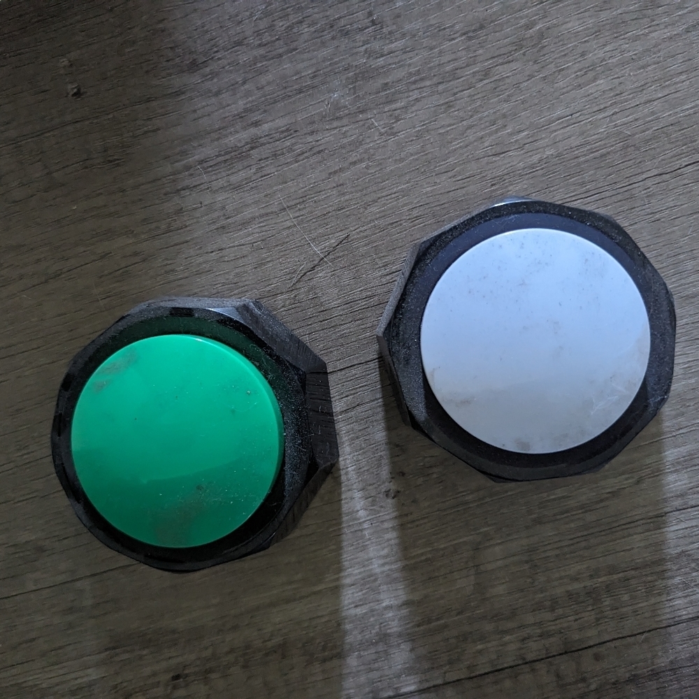 2 non used dog training buttons.